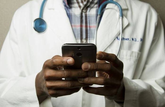 Clinician reviewing information on a device